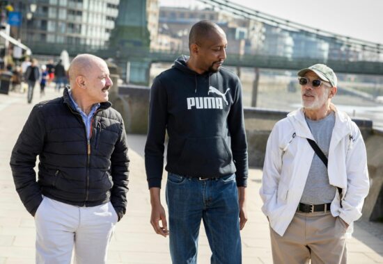 Group of men walking and chatting